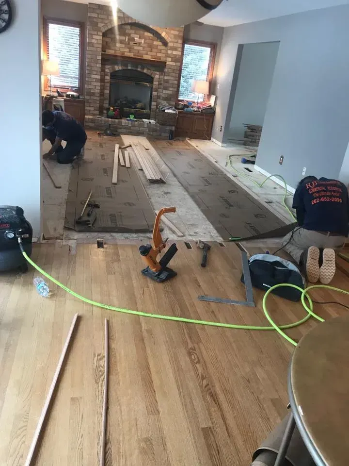Flooring installation in a living room.