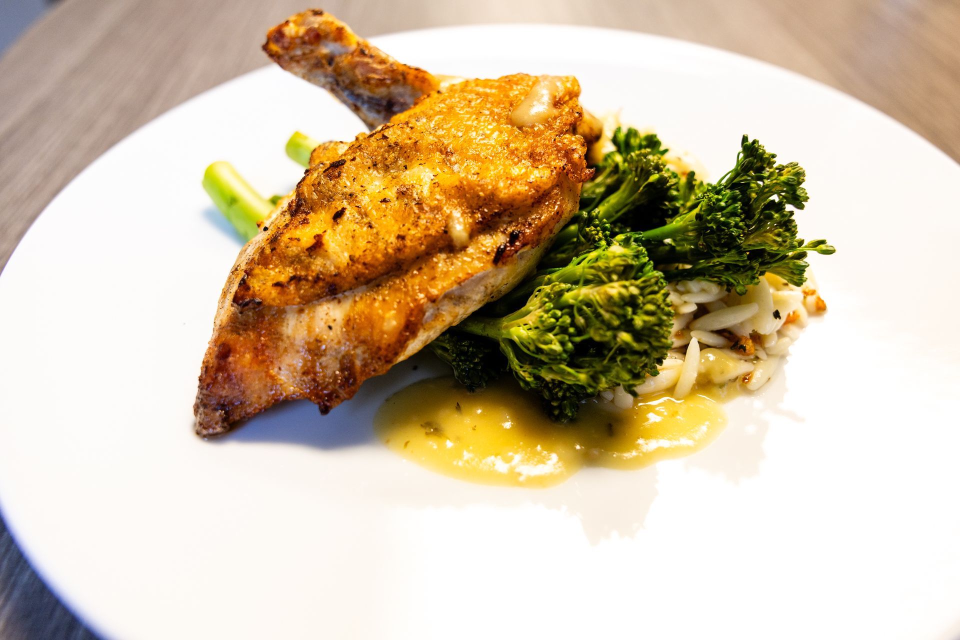 Two men are preparing food in a kitchen.
