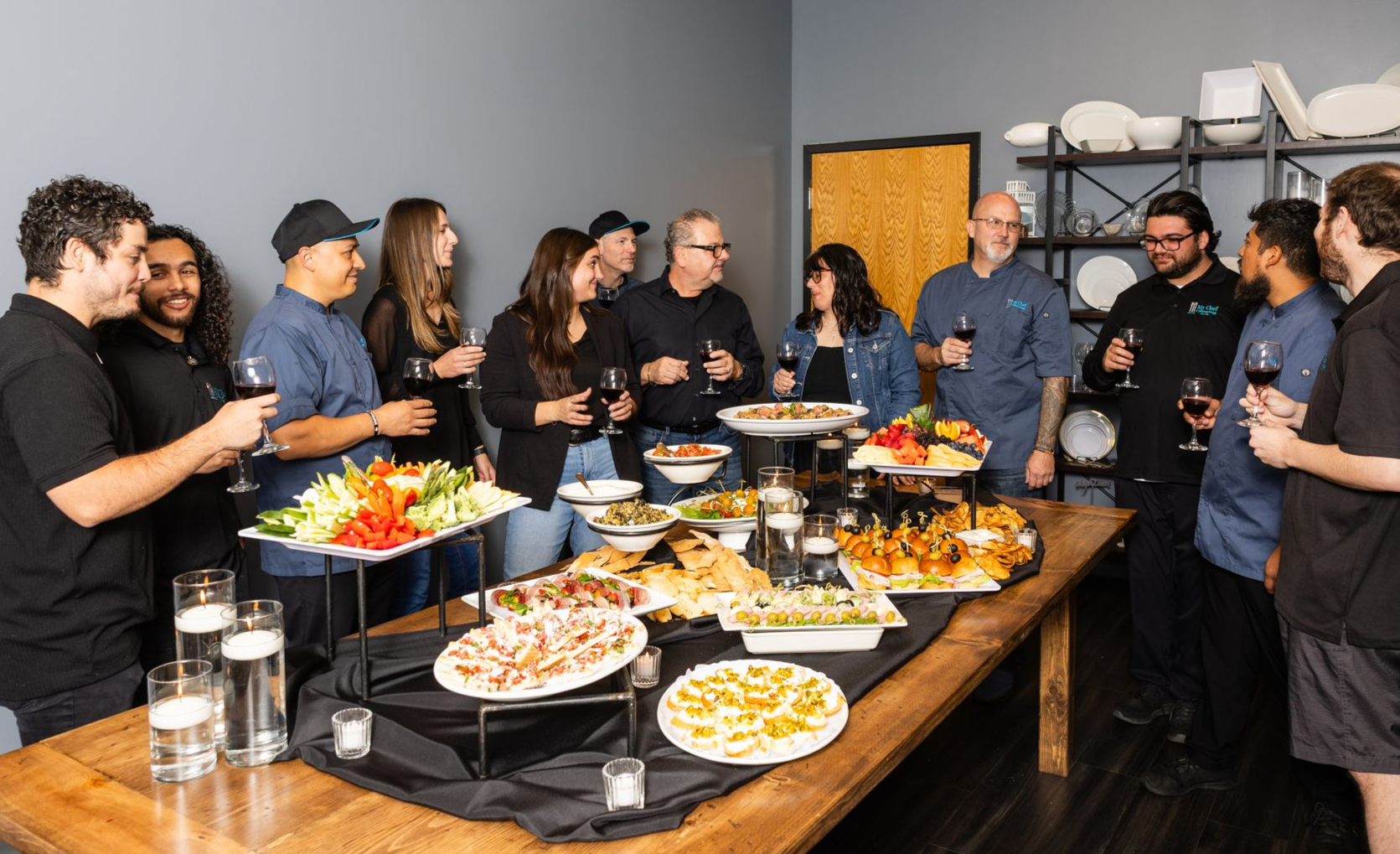 A bunch of green wraps with meat and cheese on a table.