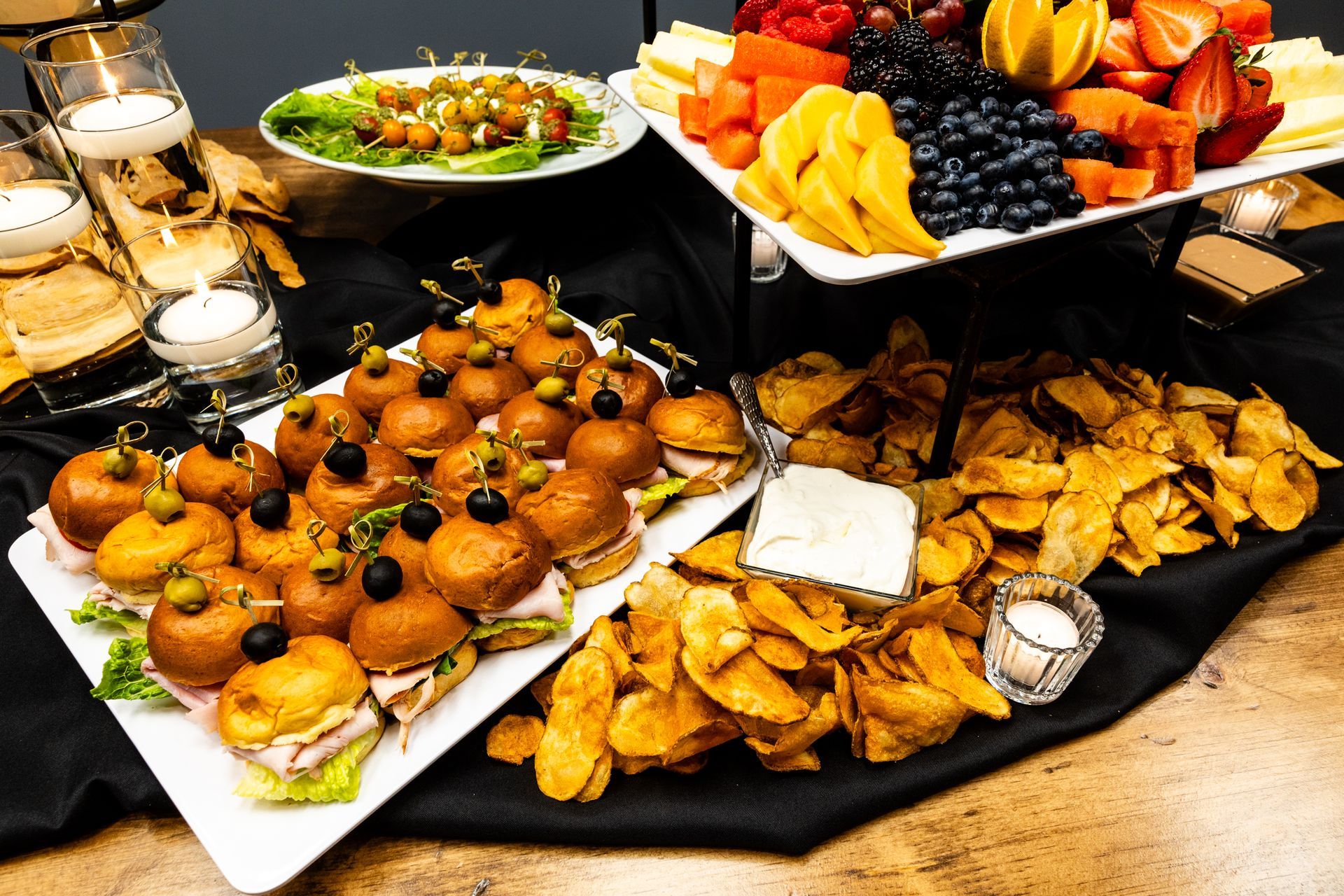 A buffet table with a variety of food on it.