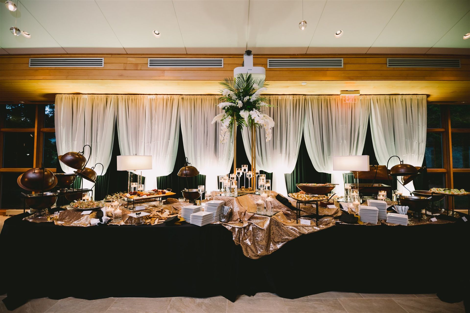 A person is holding a tray of food on a napkin.