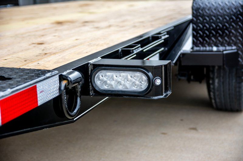 A close up of a trailer with a light attached to it.
