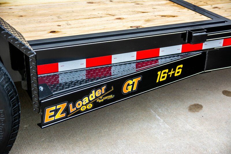 A trailer that says ez loader gt on the side