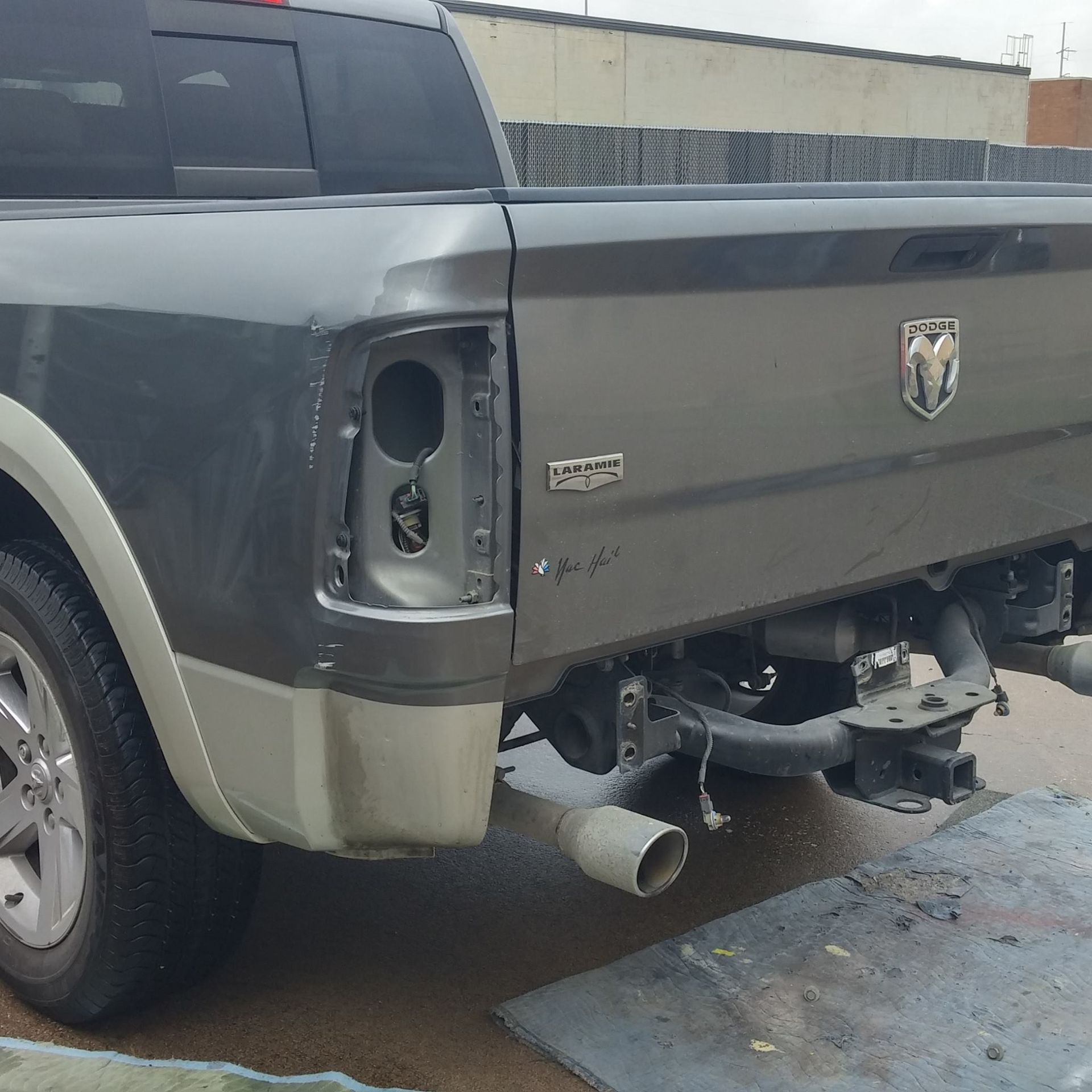 A dodge ram truck is parked on the side of the road