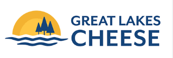 Logo for Great Lakes Cheese: yellow sun, blue trees, waves, and text 