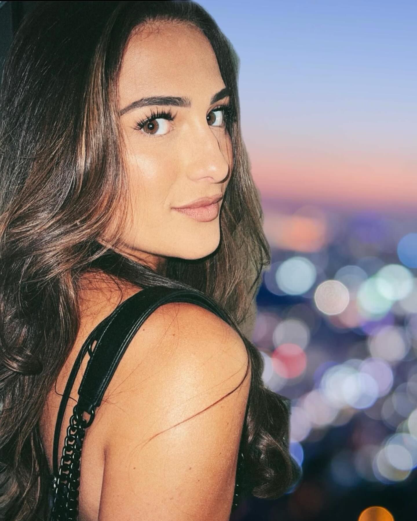 A close up of a woman 's face with a blurry background