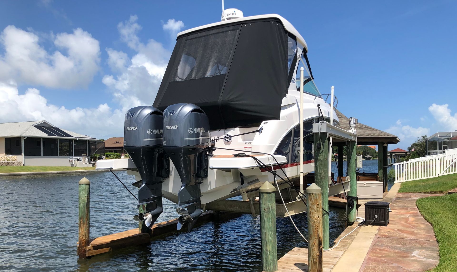 A boat is sitting on top of a dock in the water.