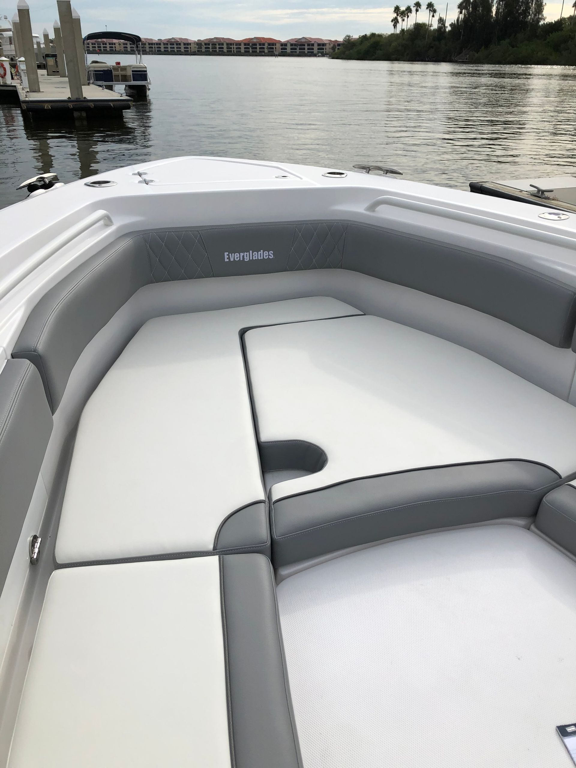 The back of a boat is sitting in the water.