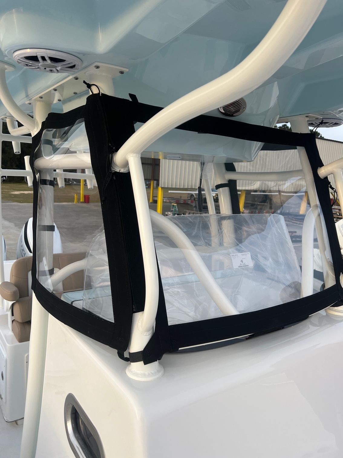 A boat with a clear windshield on top of it