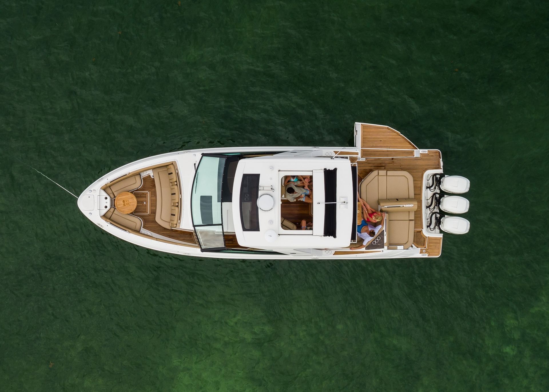 An aerial view of a boat floating on top of a body of water.