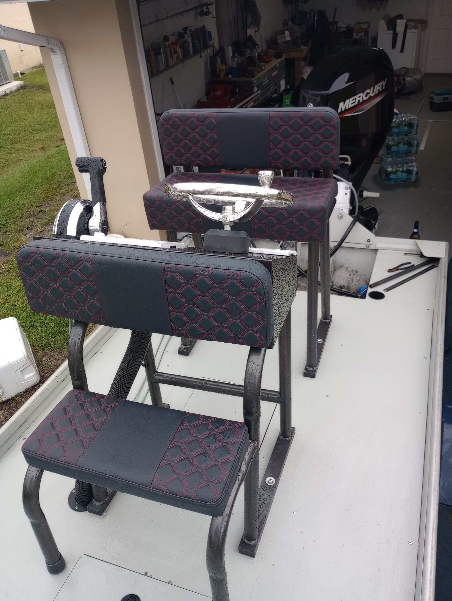 A couple of chairs sitting on top of a boat.