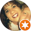 A woman is smiling next to a man in a circle with an orange star.