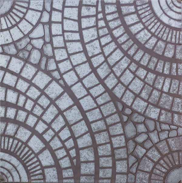 a close up of a tile with a circular pattern on it .