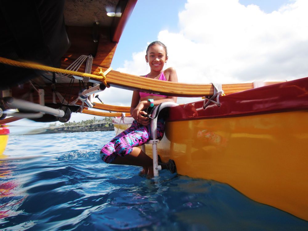 girl smiling on canoe