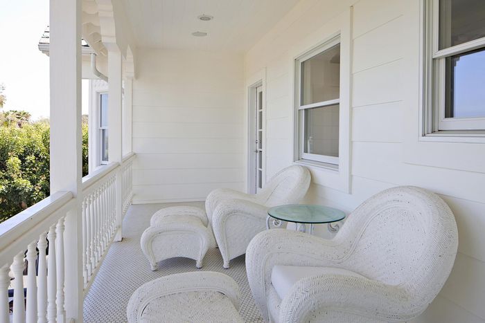 white porch with two chairs in Orange County
