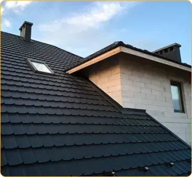 A roof with a skylight and a chimney on it