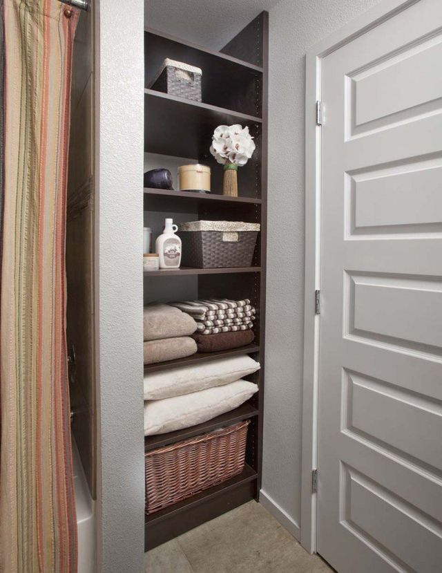 Pantry & laundry room closet organizers with custom shelving in Boston MA.