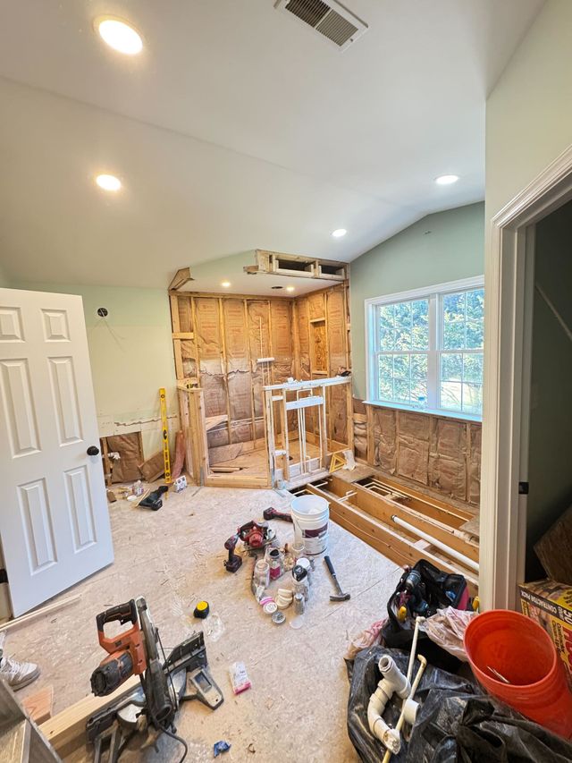 Sykesville bathroom remodel in progress, stripped to studs with new shower framing and tub drain