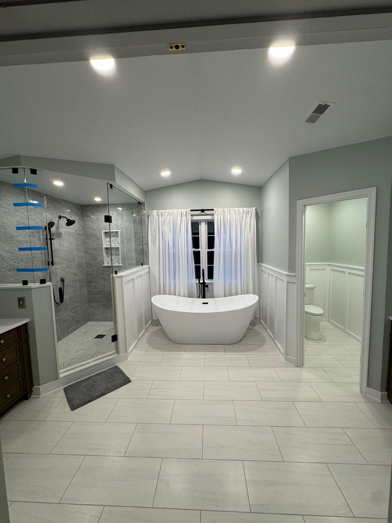 Soaking tub under the window beside a frameless glass shower – Jarrettsville, MD