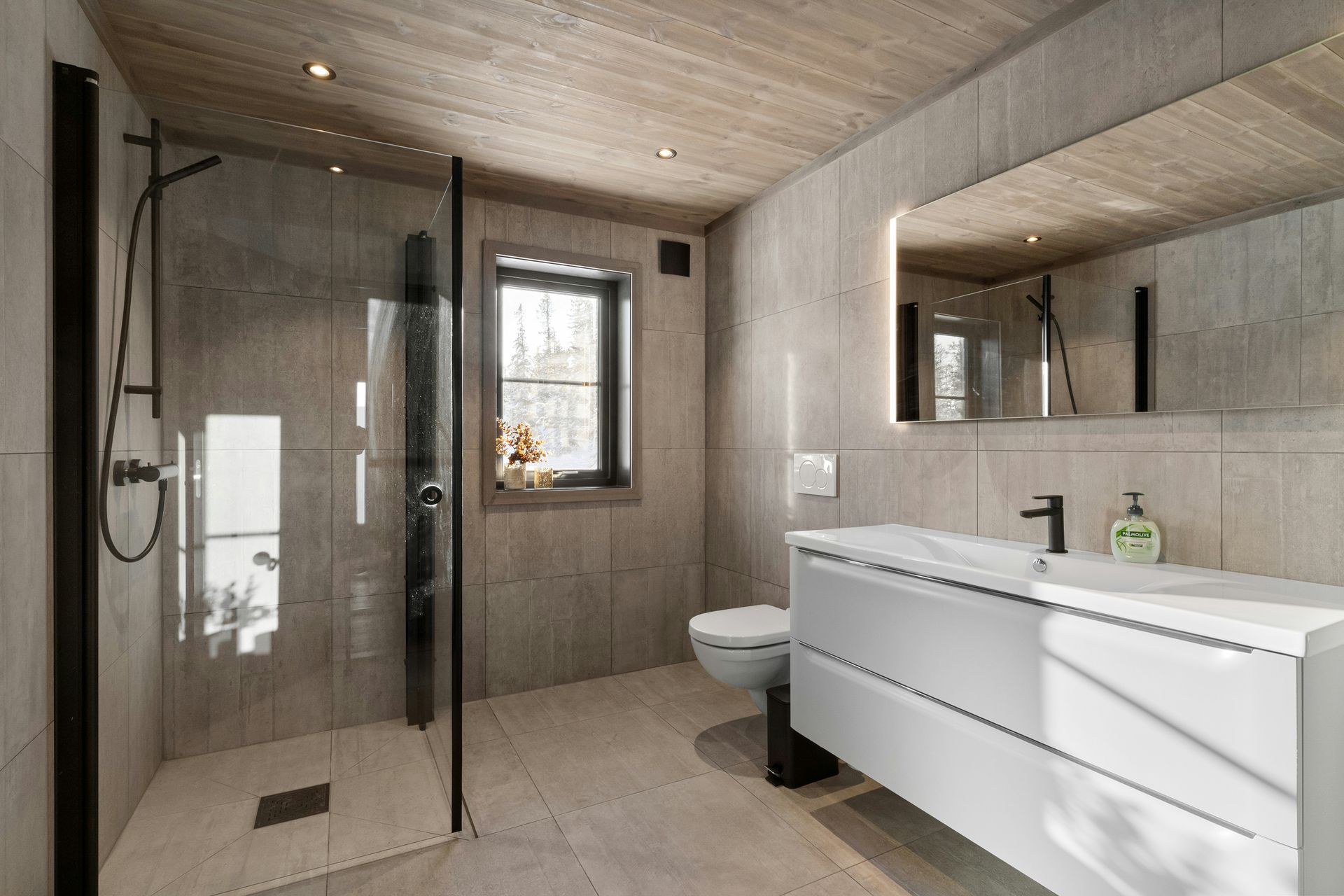 Modern bathroom with a walk-in shower, white vanity