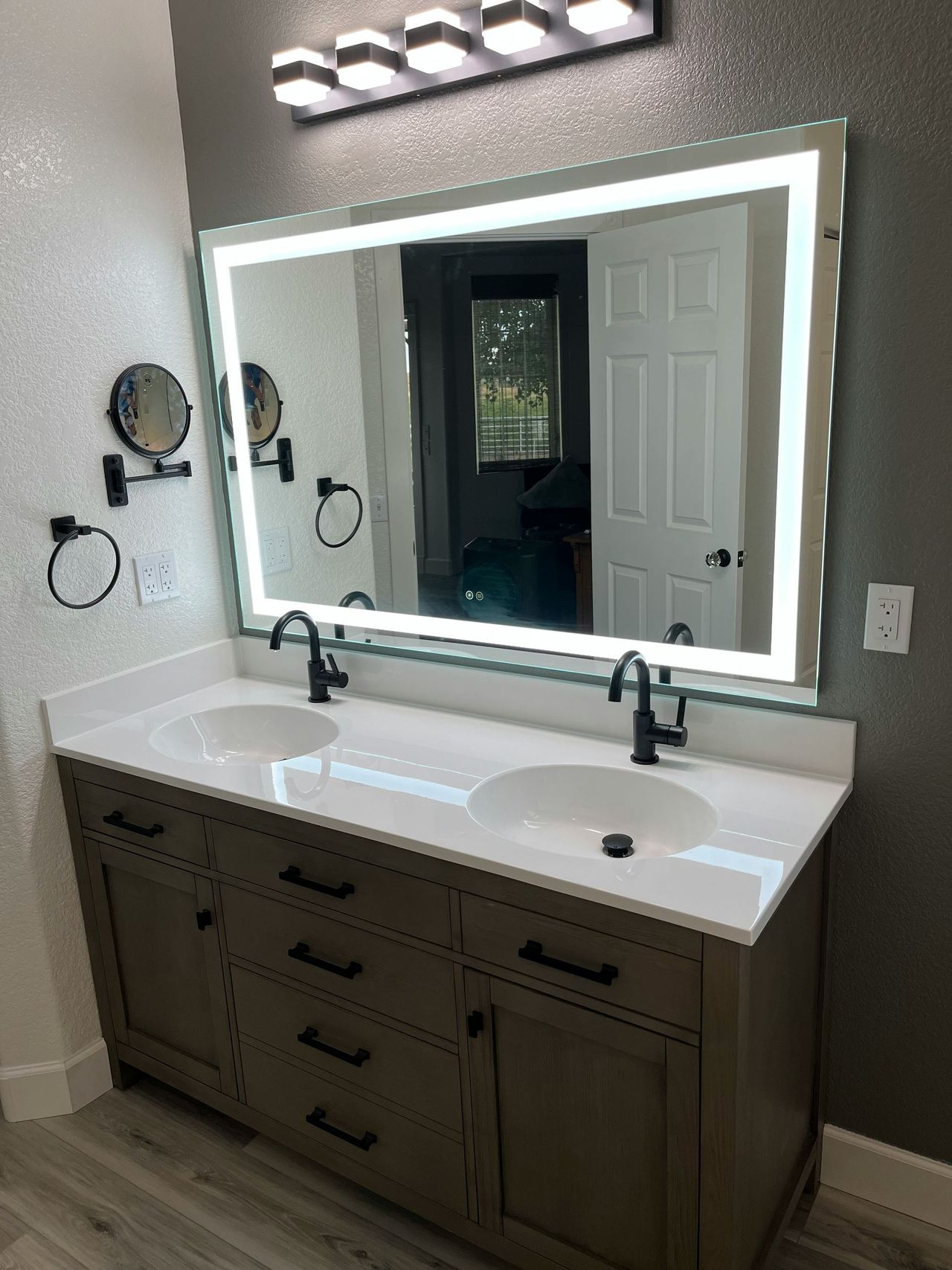 Double vanity with backlit mirror and matte black faucets – Harford County, MD