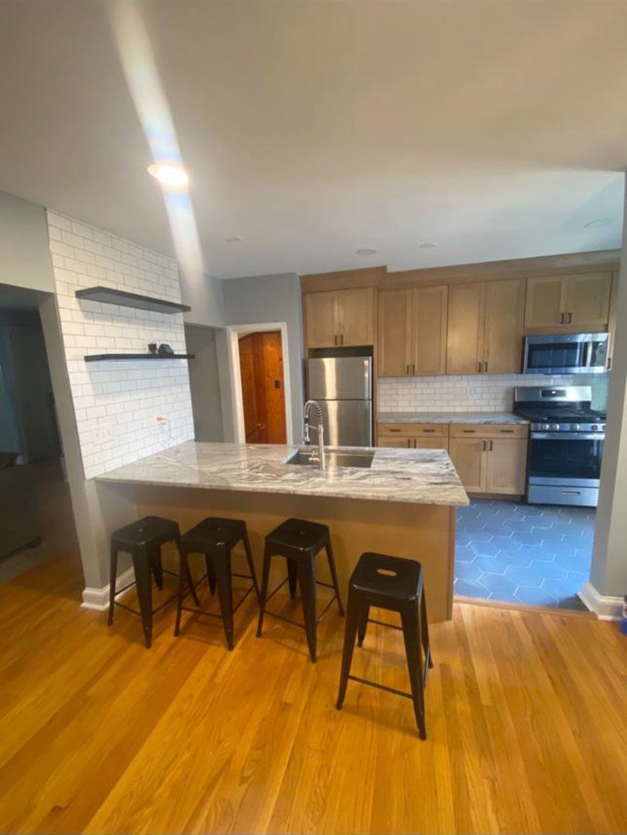 Island with open shelving in a Towson, MD kitchen remodel