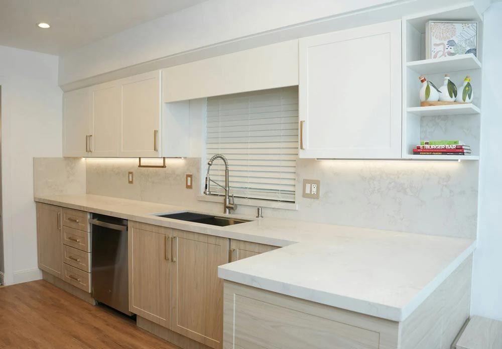 Modern kitchen with white and light wood cabinets