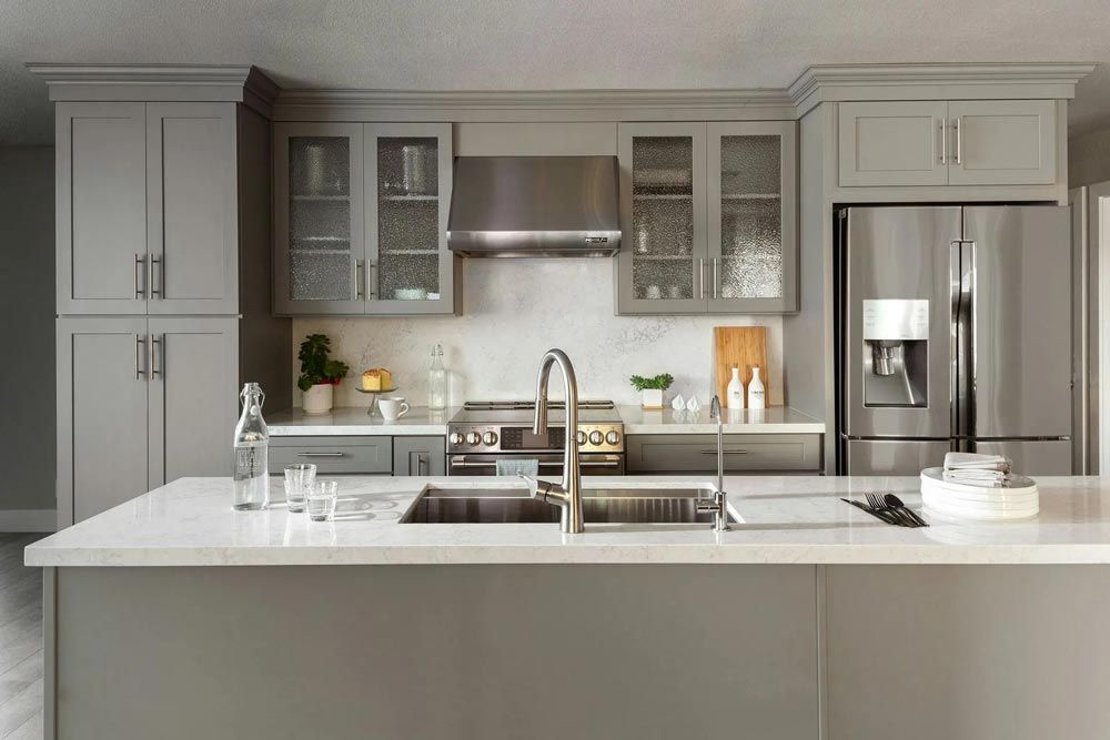 A modern kitchen with gray cabinets