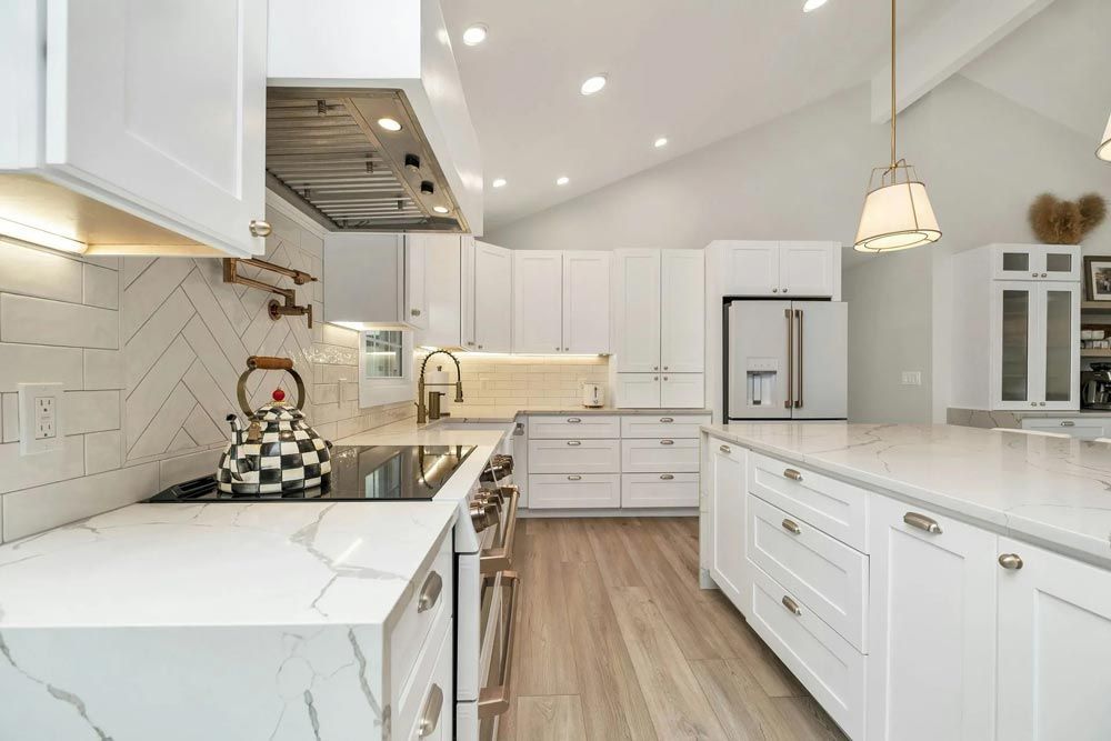 Bright, white kitchen with a large island