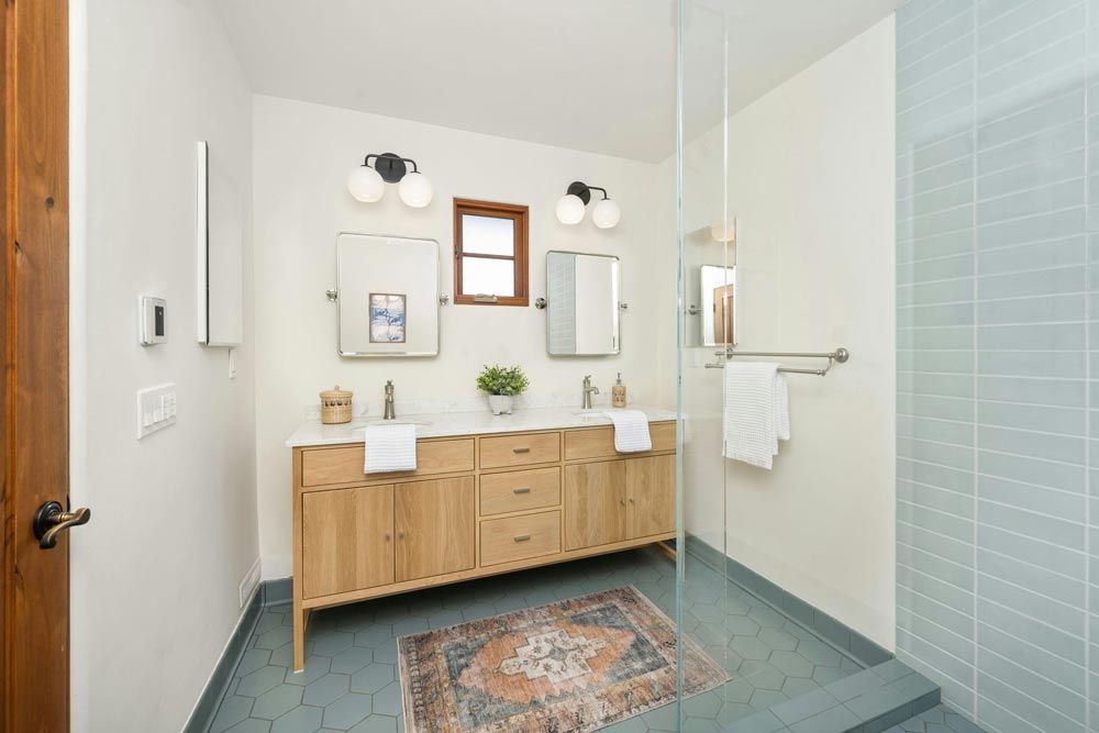 Bathroom with a light wood vanity
