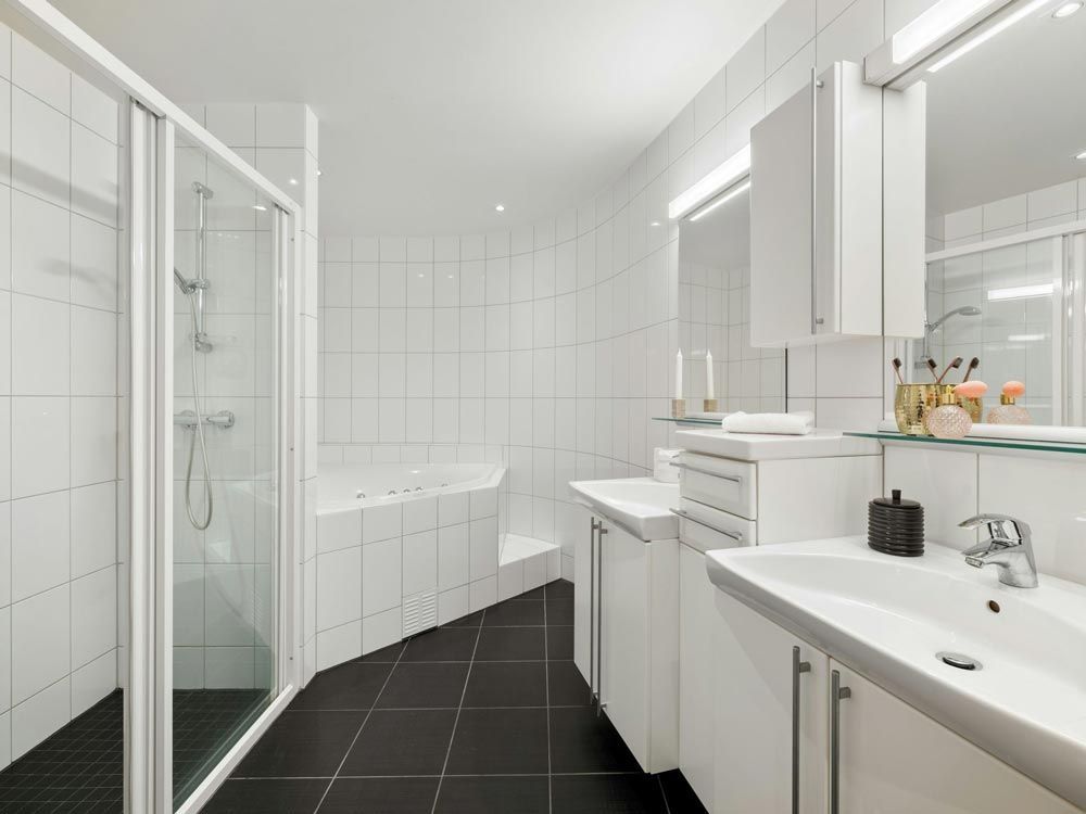 Modern bathroom with a black tiled floor
