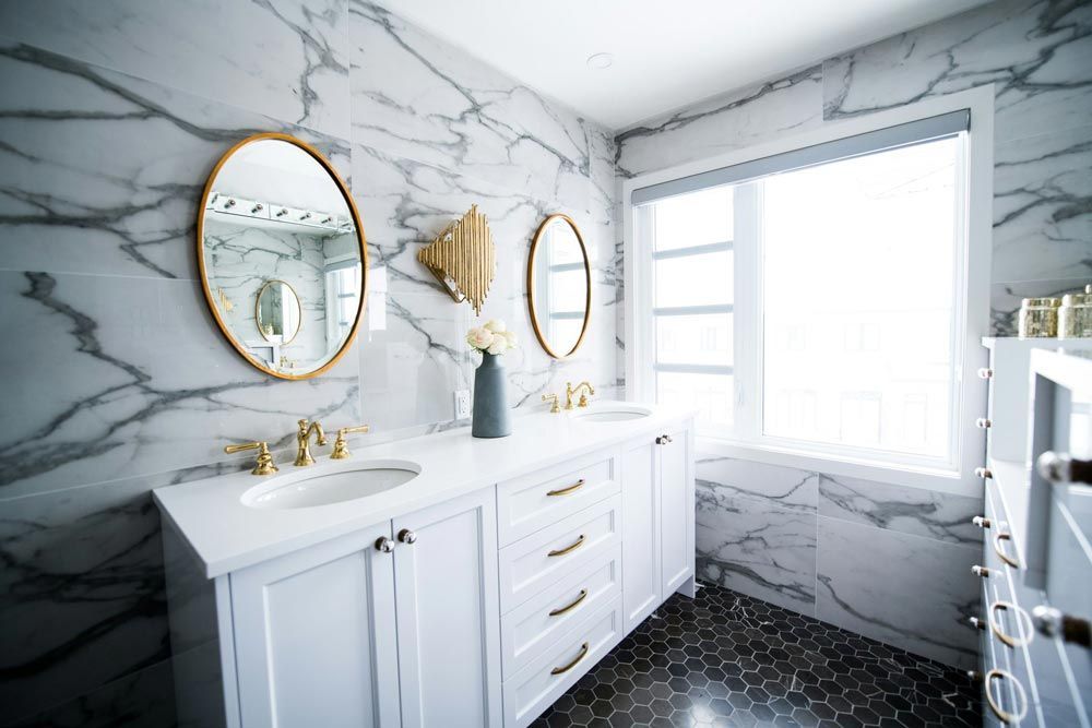 Elegant white bathroom with marble walls