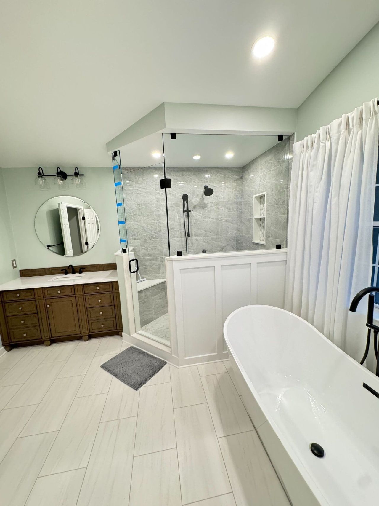 Finished walk-in shower and freestanding tub in a Sykesville, MD primary bathroom – Sykesville, MD