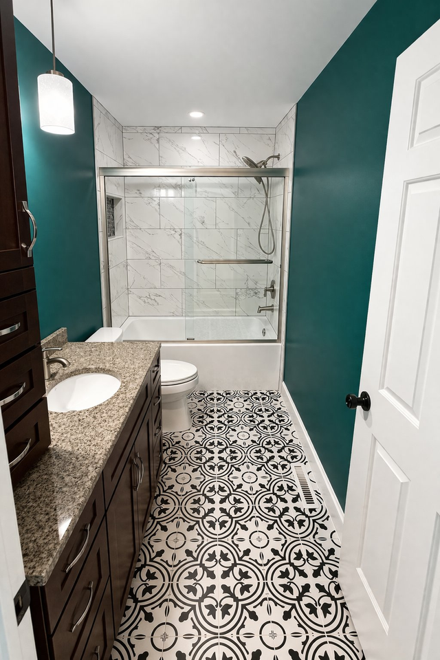 Tub-shower combo with patterned floor and a teal accent wall, a Handyman on Demand bathroom remodel