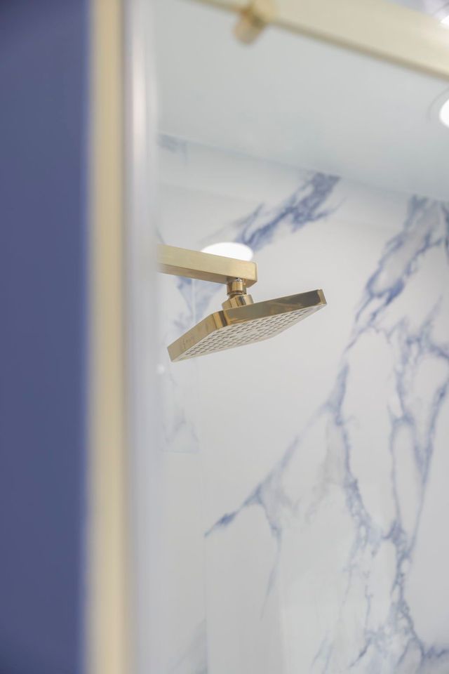 Walk in shower gold rain showerhead marble tile in Silver Spring, MD