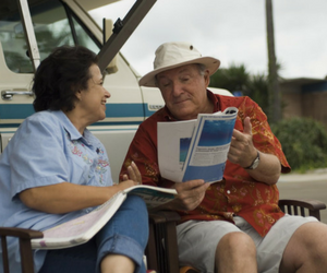 older lady and man looking at map