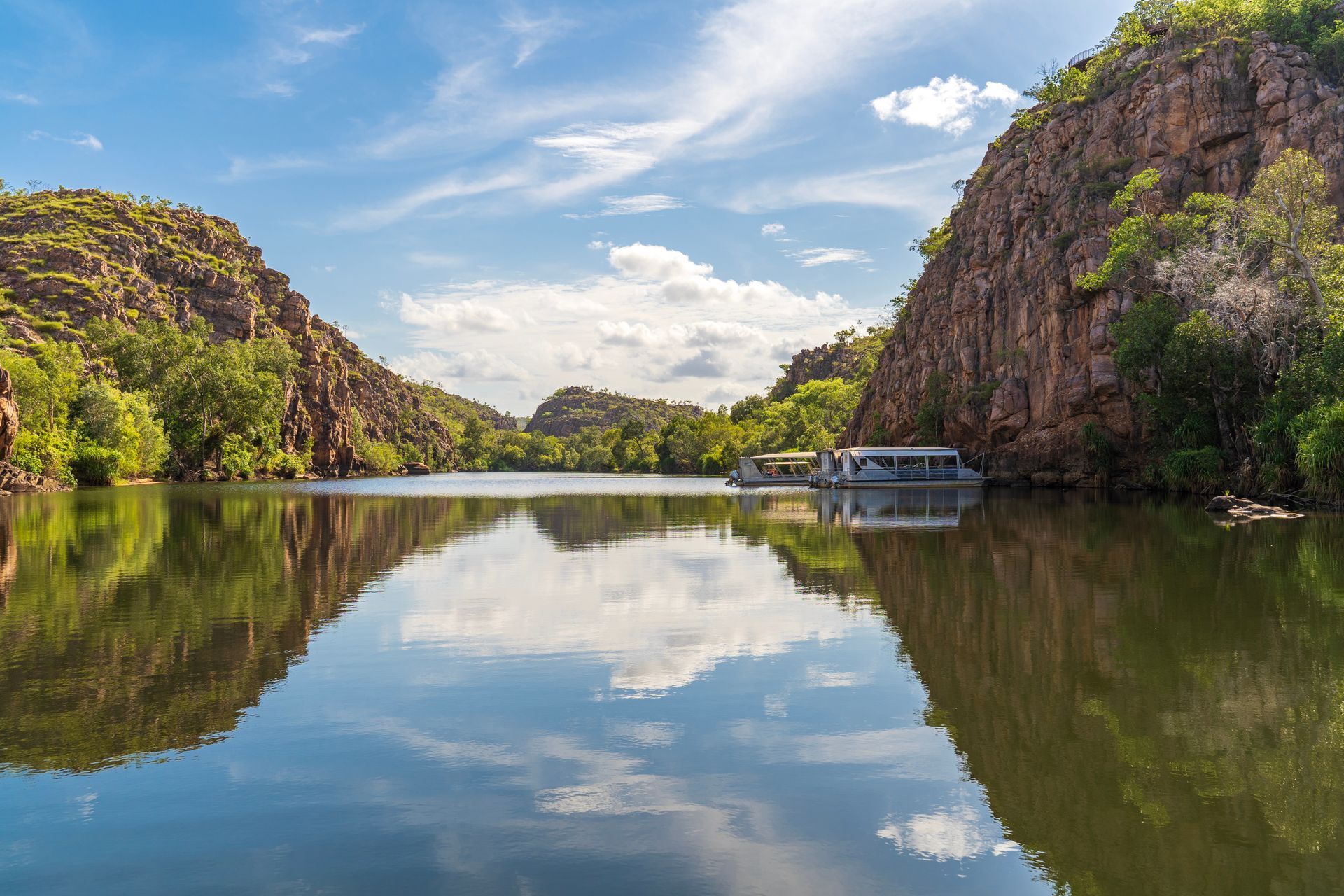 River Between Rocky Cliffs Reflecting Sky and Houseboat — Active Airconz in Katherine, NT