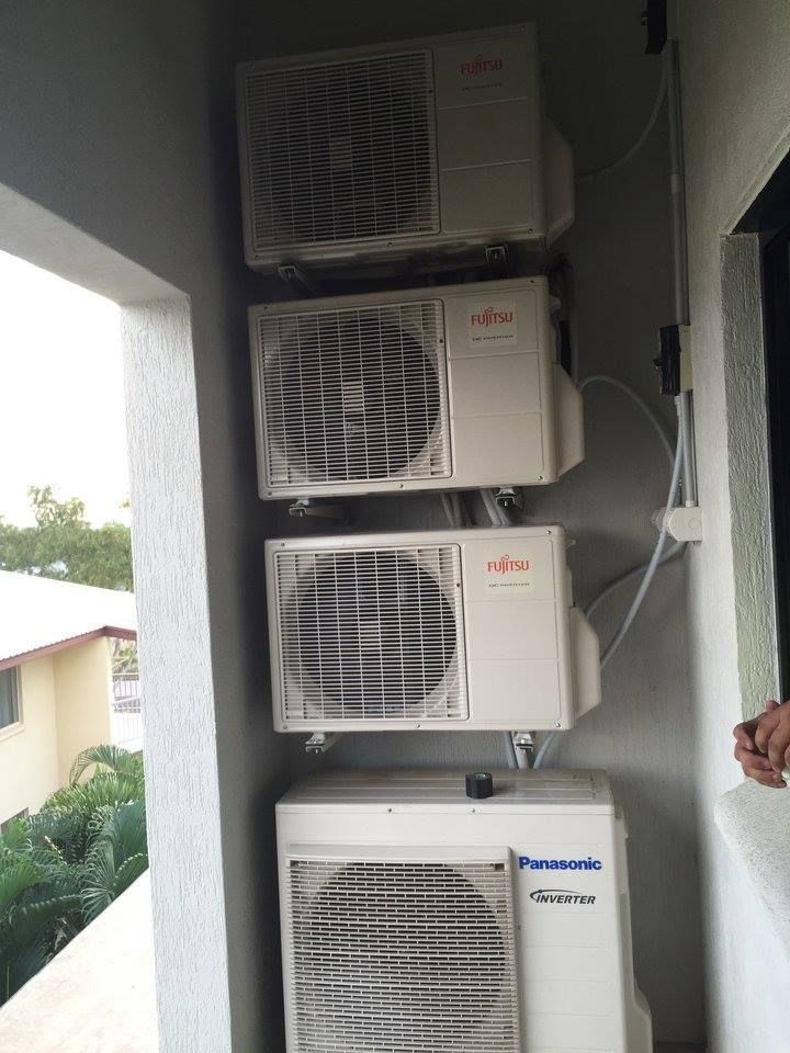 Four Stacked Air Conditioning Units on a Balcony — Active Airconz in Brisbane, QLD
