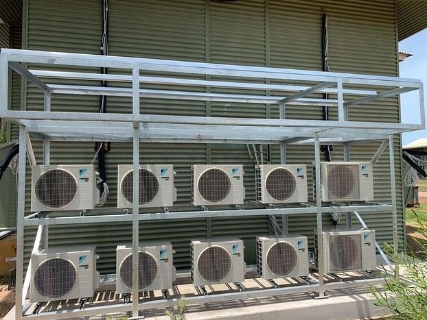 Metal Rack Holding Multiple Outdoor Air Conditioning Units — Active Airconz in Rural & Remote, NT