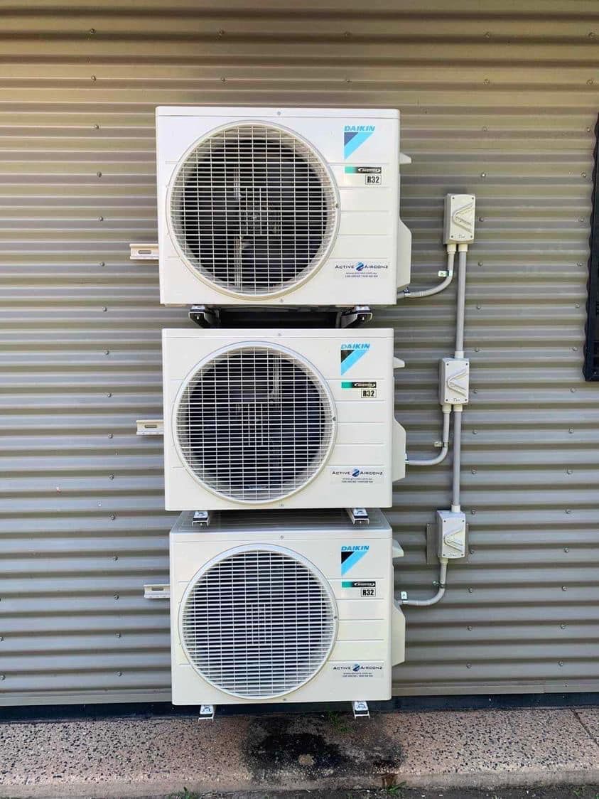 Three Stacked Daikin Air Conditioning Units Mounted on a Corrugated Metal Wall — Active Airconz in Rockhampton, QLD