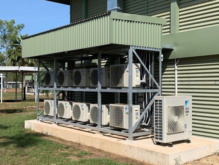 Air Conditioning Units Mounted on a Metal Frame Outside a Building — Active Airconz in Perth, WA