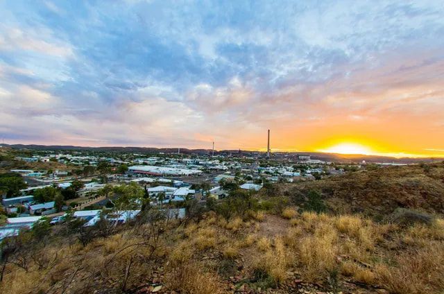 Town at Sunset, Buildings, Tall Tower, and Golden Sky — Active Airconz in Mount Isa, QLD