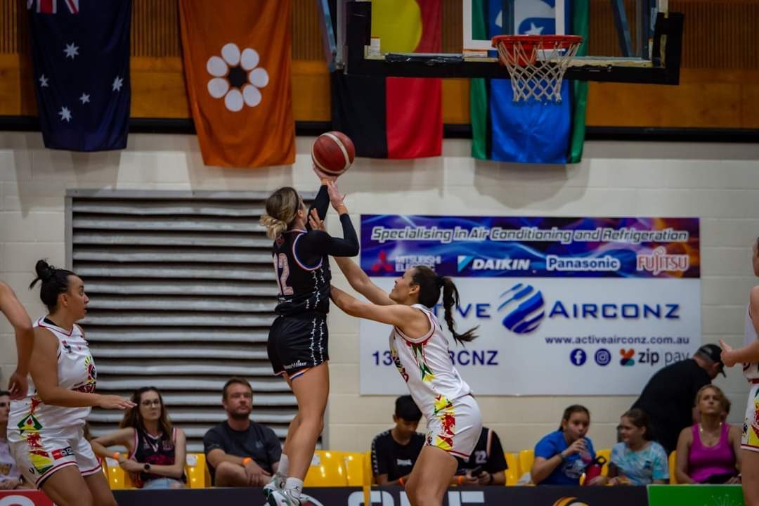 A Basketball Game Is Being Played in Front of A Banner that Says Airconz — Active Airconz in Winniellie, NT