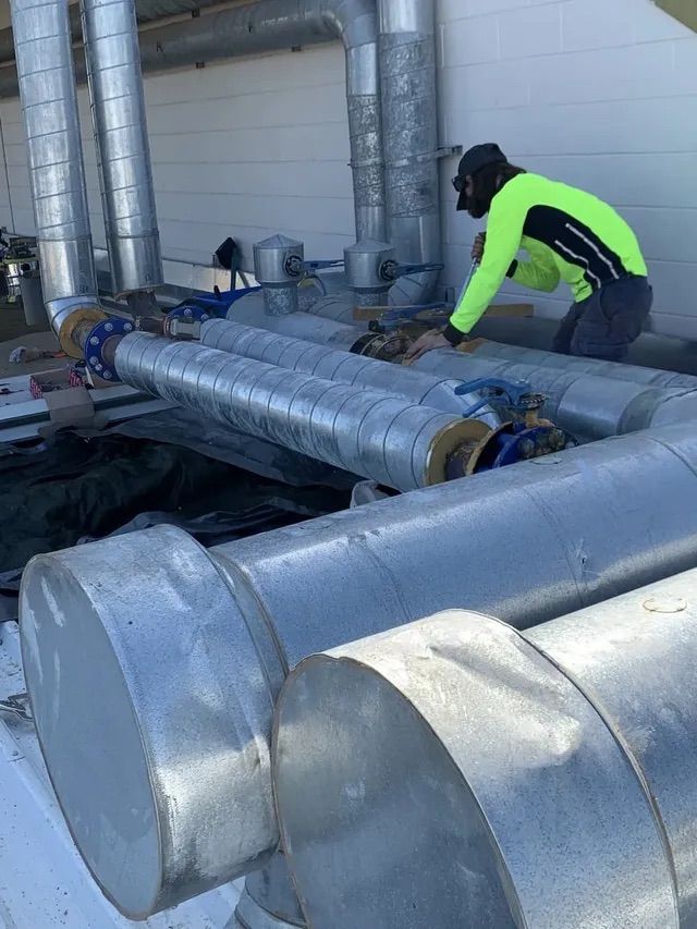 Man Working With Tubes — Active Airconz in Yarrawonga, NT
