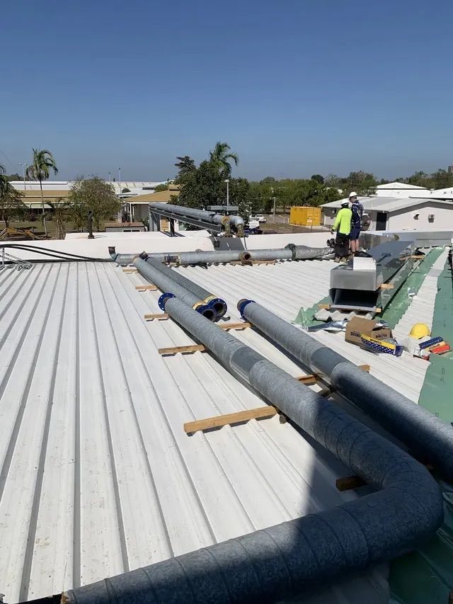 Installing Pipe On The Roof — Active Airconz in Yarrawonga, NT