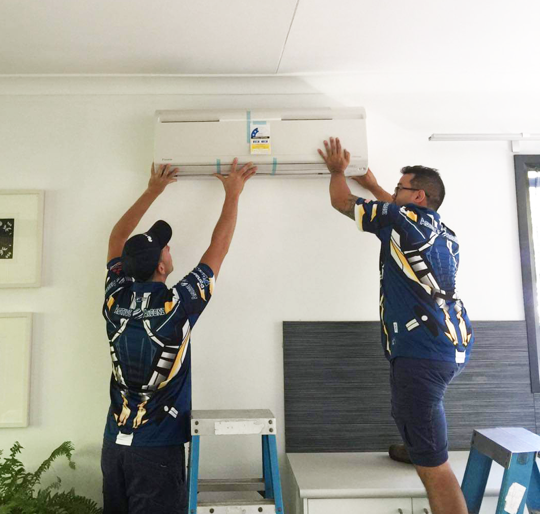 Two Men Removing Air-condition   —  Air Conditioning in Darwin