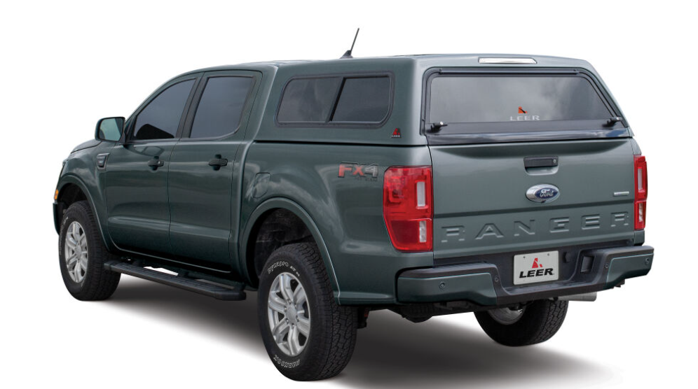 The LEER 100S, This sleek, versatile truck cap is standard equipped with the essential features customers expect, like side sliding windows with screens to catch the breeze. Convert the 100S for light-duty commercial use with optional side access doors and toolboxes.