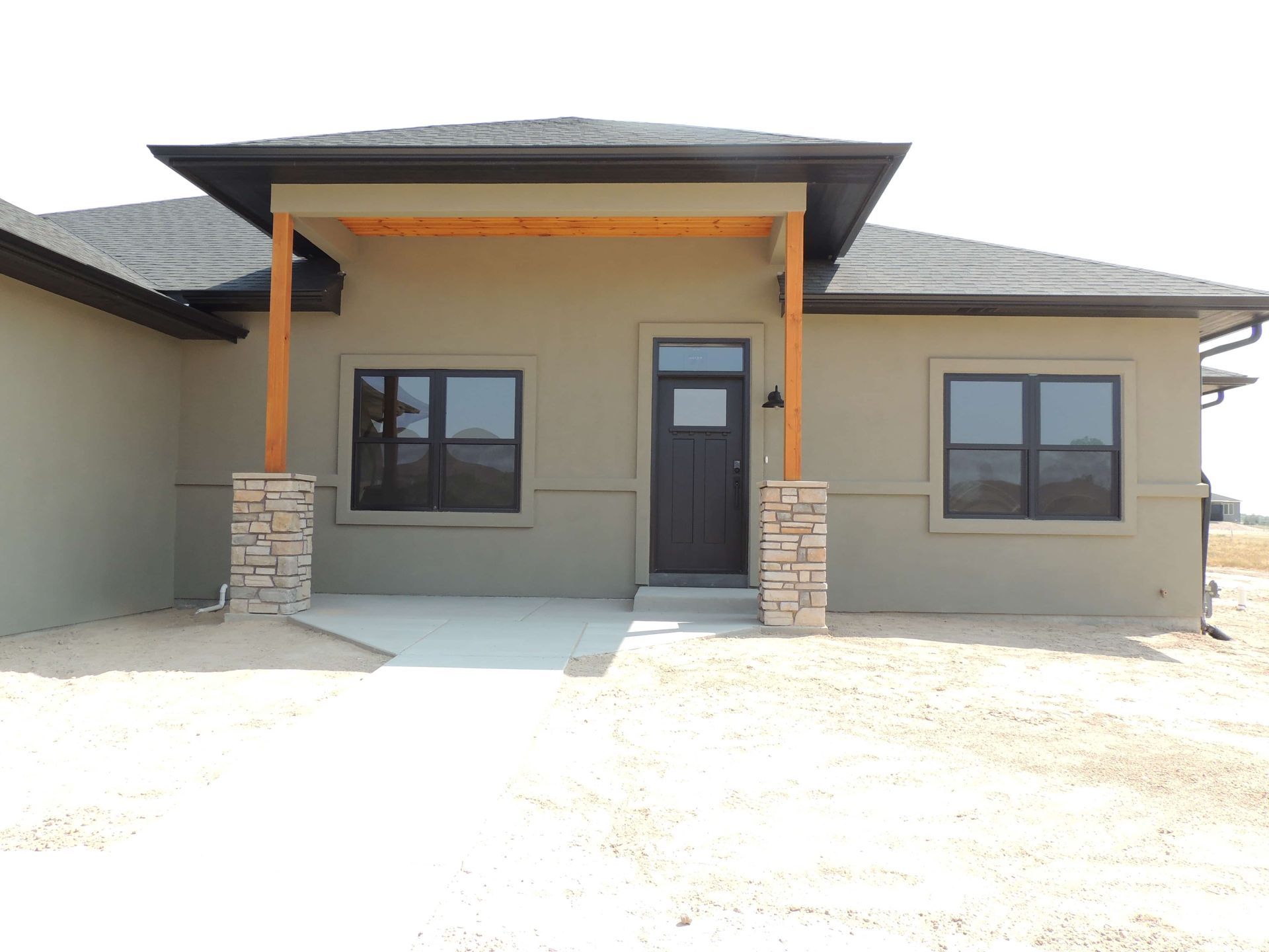 A house with a porch and a lot of windows