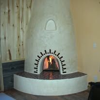 There is a fireplace in the corner of the room.