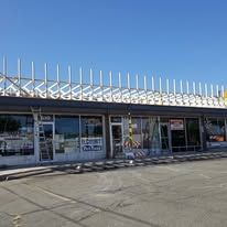 A large building with a lot of windows and a roof.
